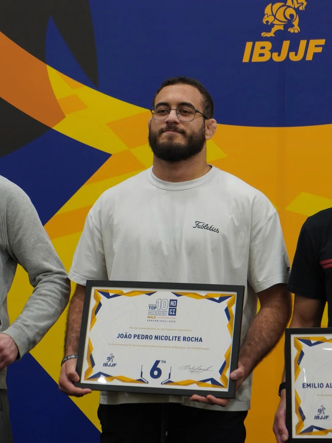 JOAO_PEDRO stands in front of IBJJF backdrop