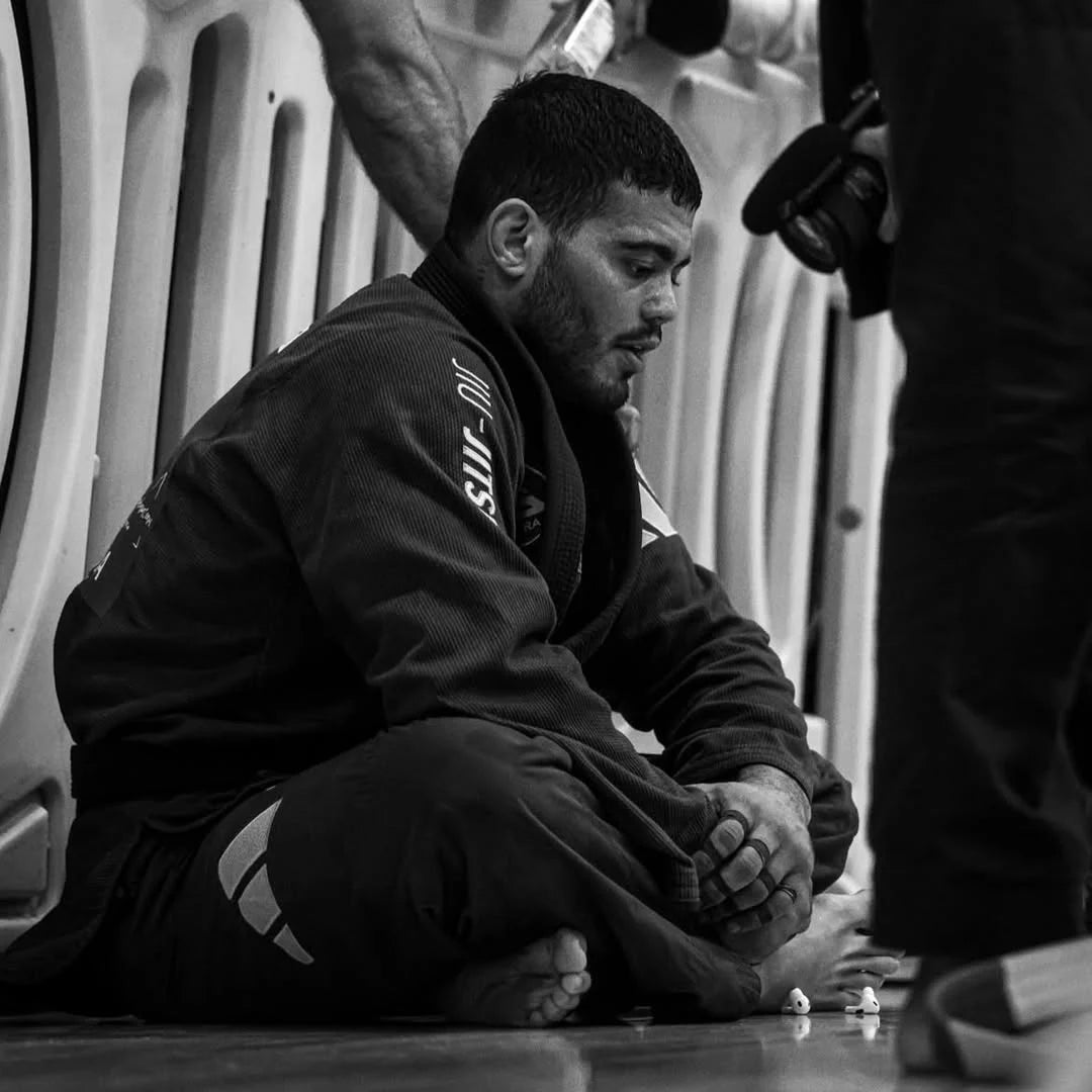 LUCAS_NORAT in a Jiu-Jitsu uniform sitting on the floor-bighorn athletics